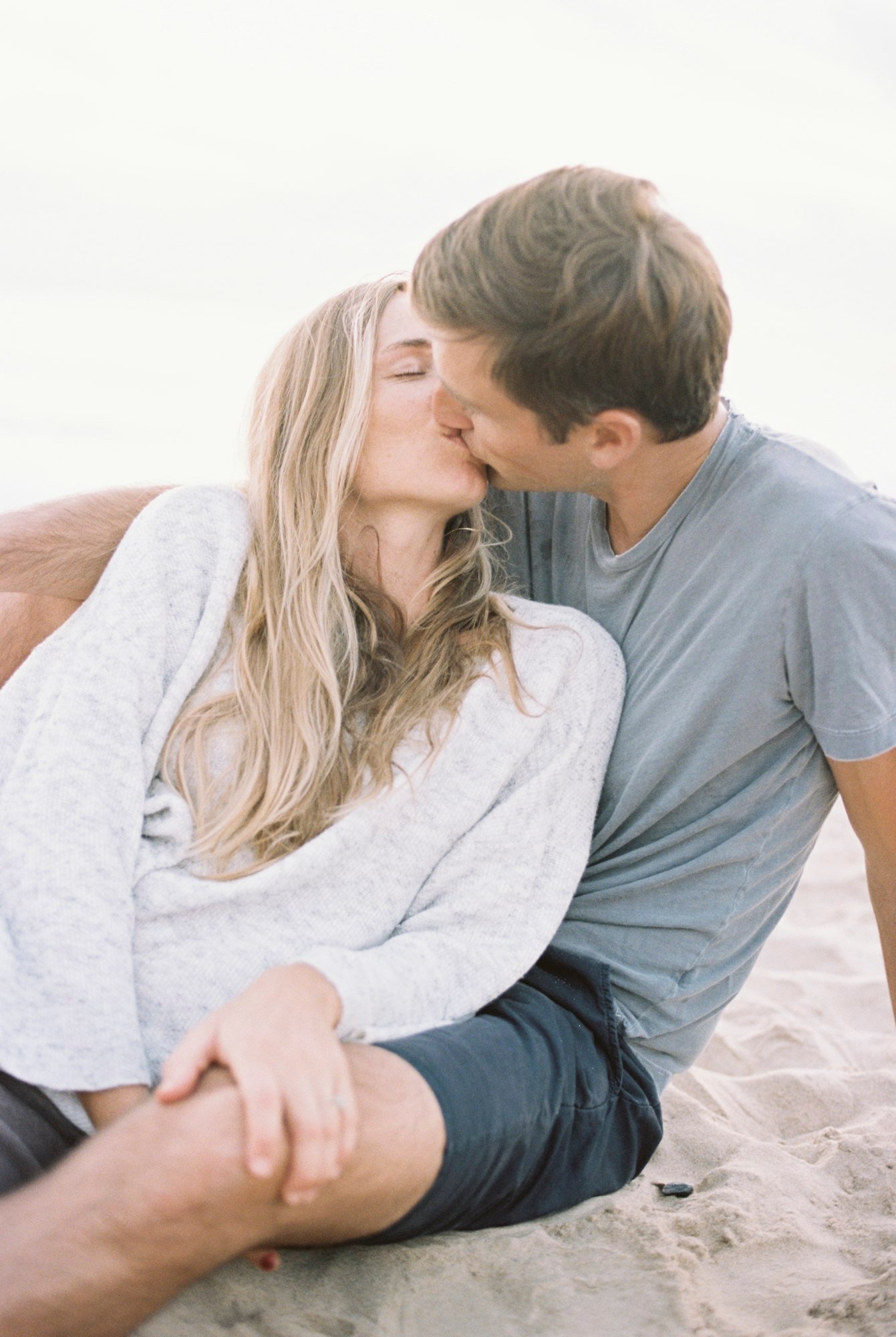 A couple kissing on a beach